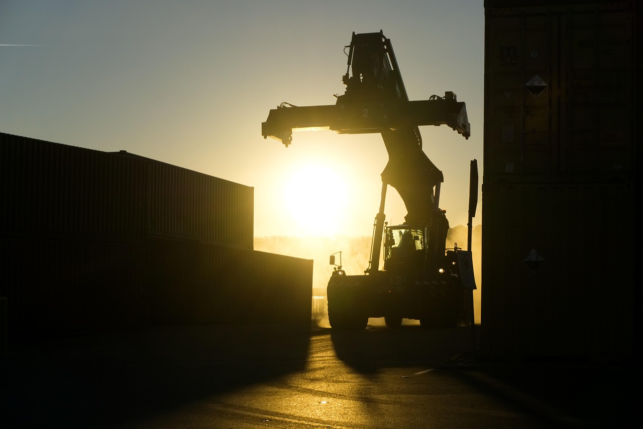 container cranes at dusk